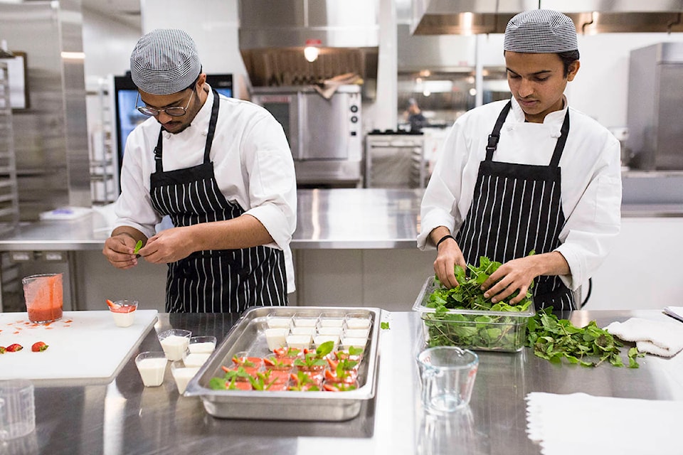 From left, Rakshid Shetty and Aishwarya Srivasdava work on preparing desserts ahead of the Autumn Harvest Dinner at North Island College on Oct. 25, 2019 in the school’s new training kitchen. The class gives tourism and hospitality students the chance to experience the kitchen side of the industry as they prepare and serve an all-you-can-eat autumn-themed buffet to paying members of the community. Photo by Marissa Tiel/Campbell River Mirror