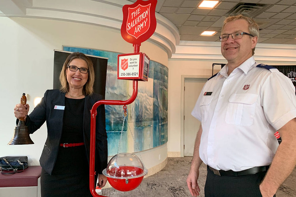 Patricia Mamic, public affairs director with The Salvation Army B.C. rings a bell alongside Patrick Humble, executive director of Victoria Community Family Services. The Salvation Army Christmas Kettle campaign launched on Nov. 19 at the Victoria Conference Centre. (Shalu Mehta/News Staff)