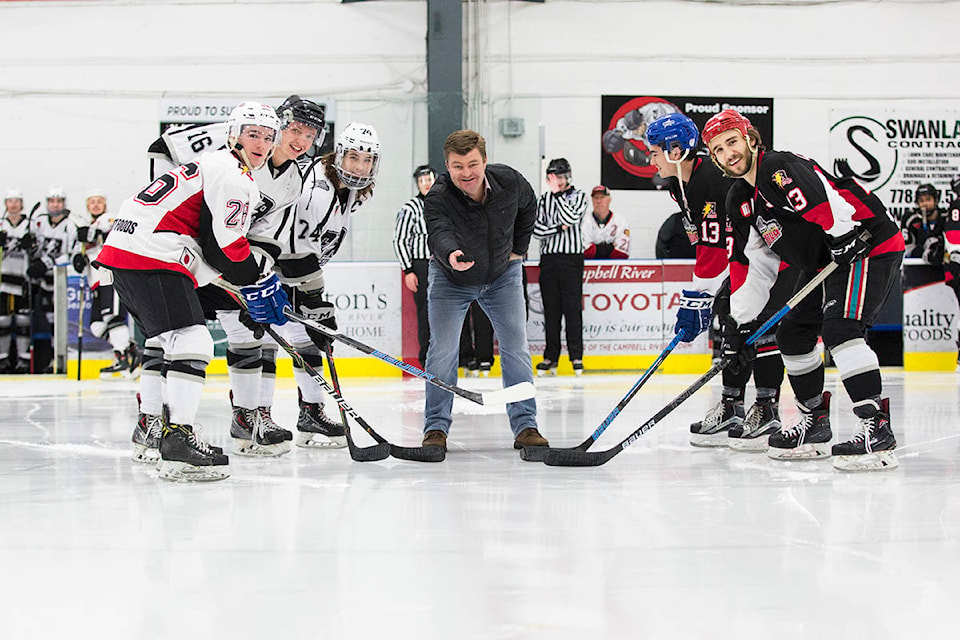 The puck drop ahead of the game featured current and past captains of the Campbell River Storm including Dylan McCann, Brayden Taekema, Kyle Jennings, Kobe Oishi and Gage Colpron. Photo by Marissa Tiel – Campbell River Mirror