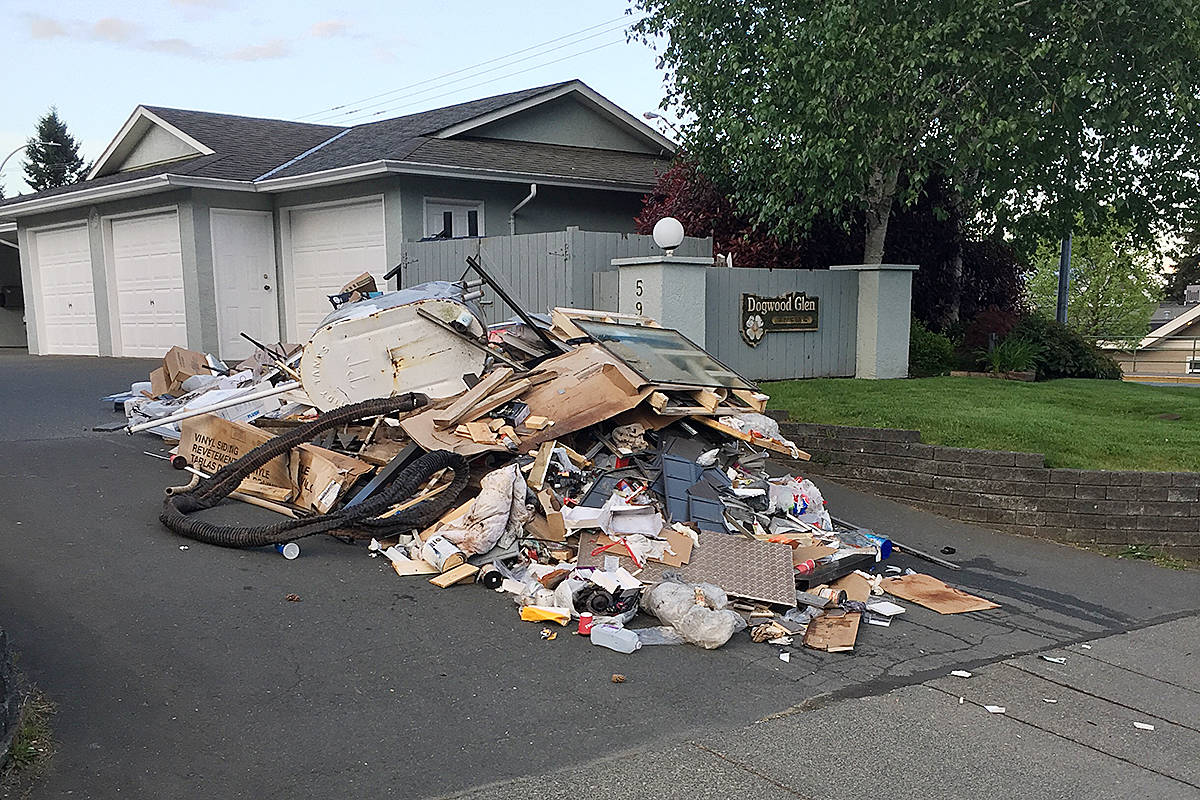 Building trash dumped on patio home driveway Campbell River Mirror