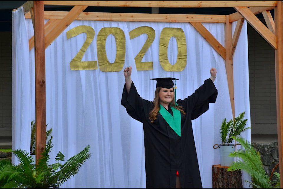 Carihi grad Lauren Clark cheers her success at the school’s 2020 drive-through graduation ceremony June 20. Photo by Alistair Taylor – Campbell River Mirror
