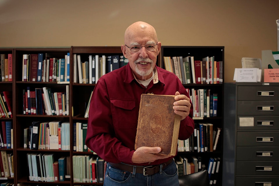 Larry Short wanted to find the owner of a 166-year-old Bible found in an old family home, and engaged the Campbell River Genealogy Society to help. Photo by Marc Kitteringham, Campbell River Mirror.