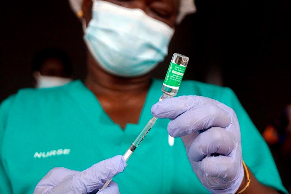 FILE - In this Friday, March 12, 2021 file photo, a nurse prepare one of the country’s first coronavirus vaccinations, using the AstraZeneca vaccine manufactured by the Serum Institute of India and provided through the global COVAX initiative, at Yaba Mainland hospital in Lagos, Nigeria. Although the AstraZeneca vaccine produced in Europe has been authorized by the continent’s drug regulatory agency, the same shot manufactured in India by the world’s biggest vaccine maker has not been given the green light. The EU regulator says the drugmaker hasn’t completed the necessary paperwork on the Indian manufacturing site, including detail on its production practices and quality control standards. (AP Photo/Sunday Alamba, file)