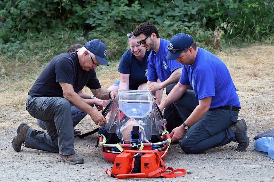 Campbell River Search and Rescue (CRSAR) volunteers prepare a stretcher with training dummy for transport. Photo by Sean Feagan / Campbell River Mirror.