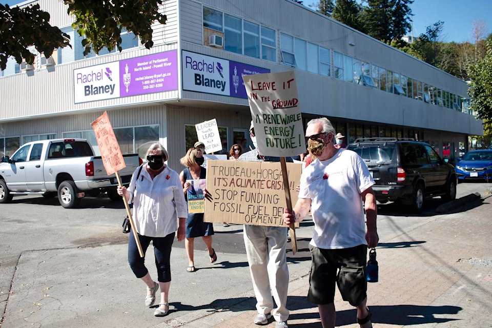 Protesters walked from MP Rachel Blaney’s office to the CIBC bank in downtown Campbell River. Photo by Marc Kitteringham / Campbell River Mirror