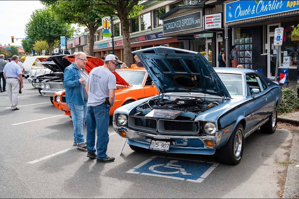 Visitors to the North Island Cruisers Show n’ Shine checking out some classic rides in downtown Campbell River on Sept. 5, 2021. Photo by Sean Feagan / Campbell River Mirror.