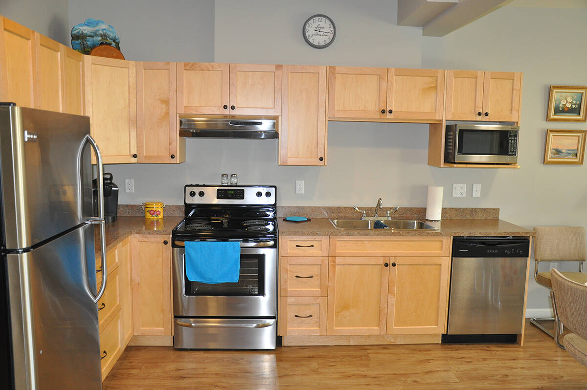 The Hospice Suites at Evergreen include a fully outfitted kitchen, in-suite laundry, patient bedroom, a second bedroom, hide-a-bed couch and an accessible bathroom with a wheelchair accessible shower.