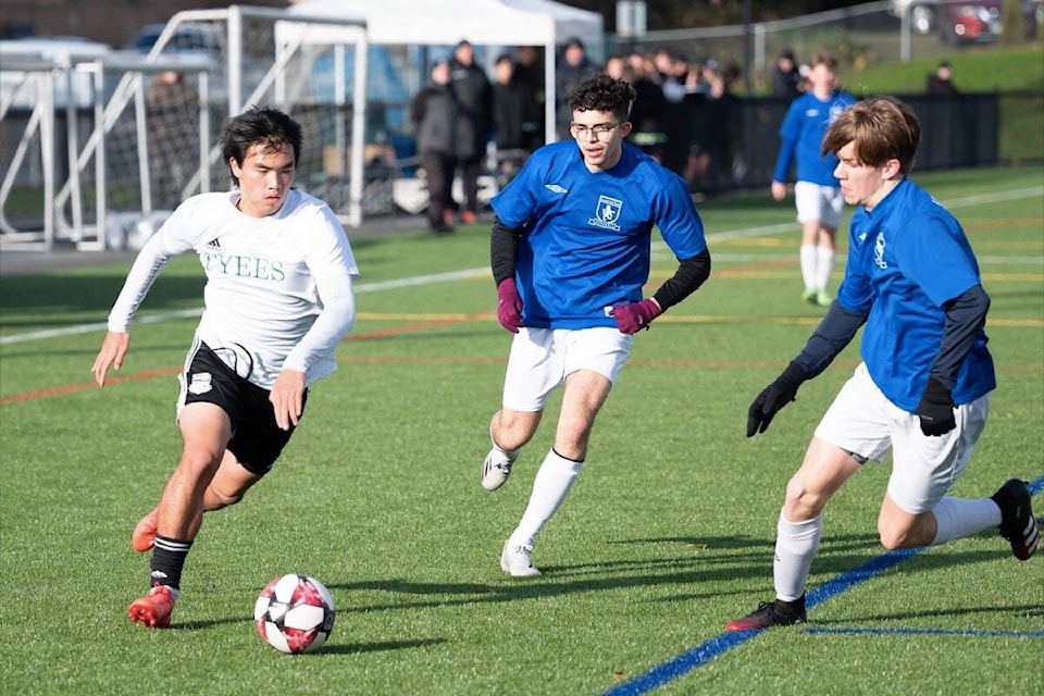 Emile Abele of the Carihi Tyees senior boys soccer team evades Lambrick Park players during the Island Championship final on Nov. 9. Photo by Sean Feagan / Campbell River Mirror.