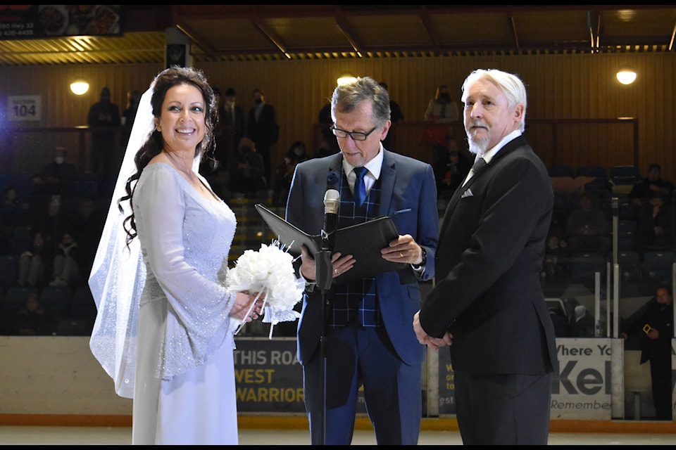 Radka Malyk and Jim Peck were married by West Kelowna Warrior’s Chaplain Don Richmond during the November 27 game. (Cole Schisler photo)