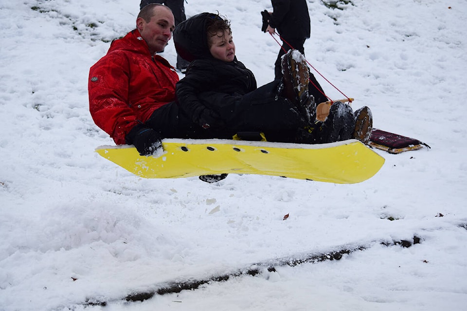 A father and son get some great air while tandem sledding on the Sportsplex hill in Campbell River. Ronan O’Doherty/ Campbell River Mirror