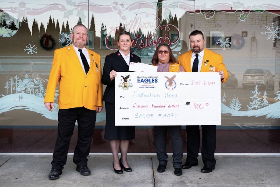 The Fraternal Order of Eagles Campbell River Aerie and Auxiallary presented a $1,100 cheque to the Salvation Army on Dec. 2, 2021. Aerie member Al Tripple (l-r), Captain Violet Hopkins, Ladies Auxillary president Franca Warkentin, and Aerie president Daryl Hippolt. Photo by Sean Feagan/Campbell River Mirror