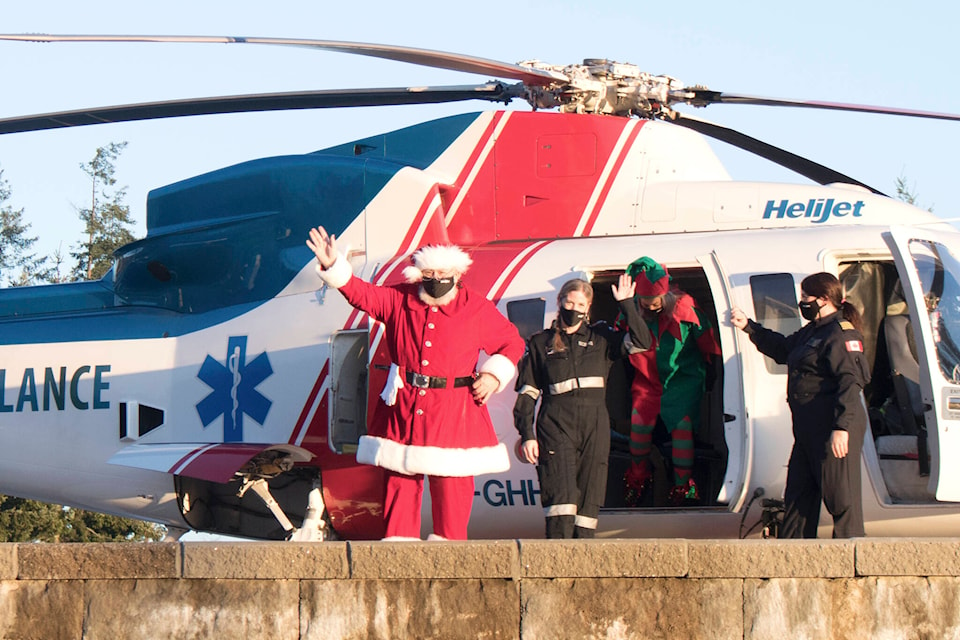 Santa lands at Victoria General Hospital in BC Emergency Health Services’ helicopter. (Bailey Moreton/News Staff)