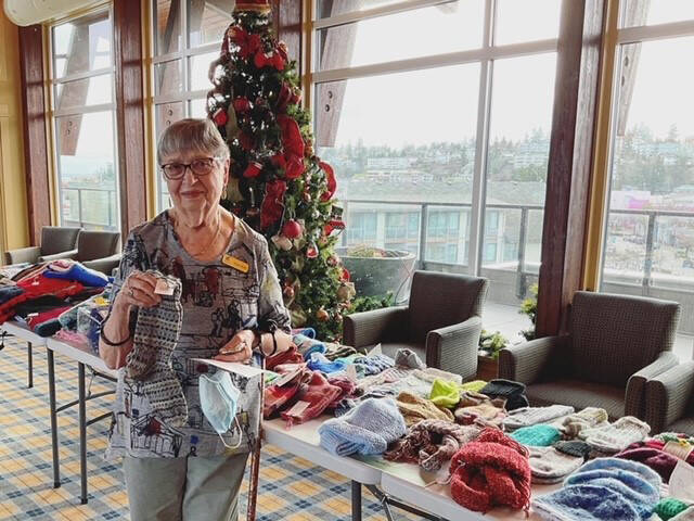 Regie and the many other Berwick knitters worked all year to make inventory for the annual Craft and Bake Sale. All leftover knitted items were donated to the food bank, along with the large cash donation.