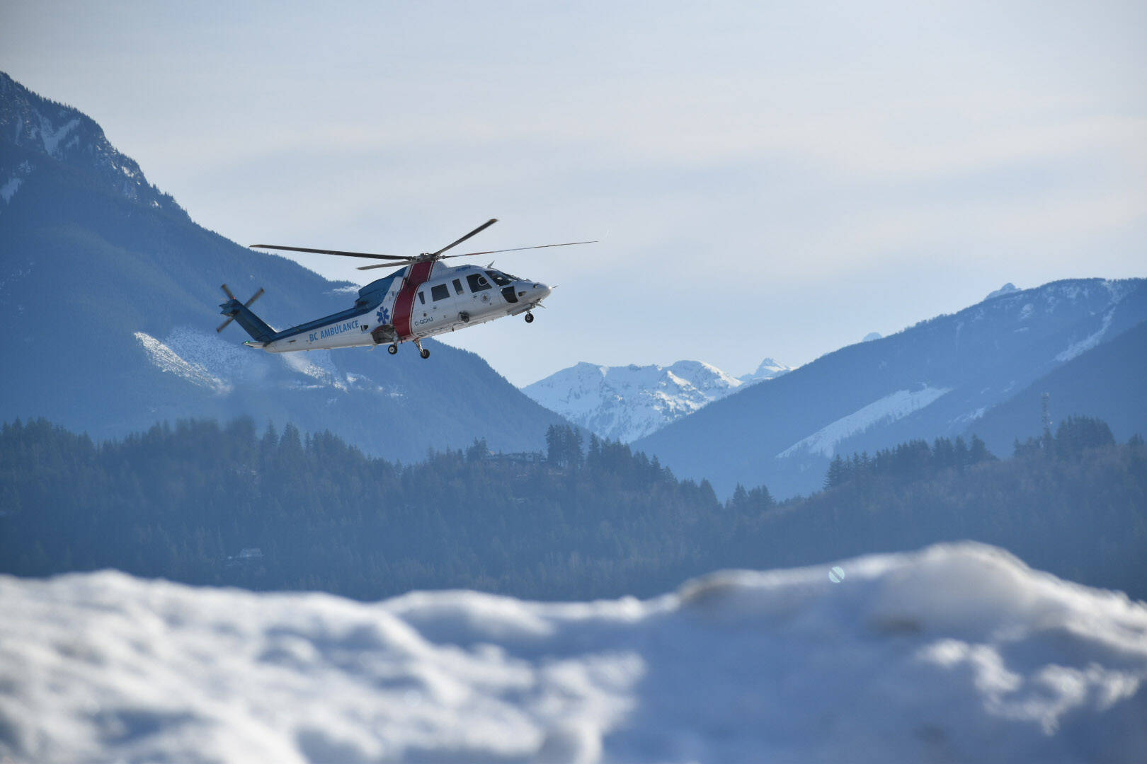 An air ambulance lands at the Chilliwack Airport following a collision on Young Road where a dump truck went into a ditch under the Highway 1 overpass on Friday, Jan. 14, 2022. (Mace MacGowan)