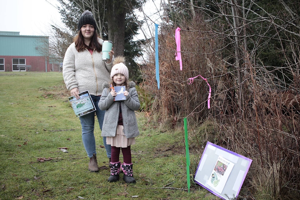 Hannah and Lorelai Devries head to the first clue in the Campbell River Family Literacy Week scavenger hunt on Sunday. Photo by Marc Kitteringham / Campbell River Mirror
