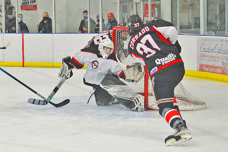 Campbell River Storm forward Nolan Corrado slams a puck into the Port Alberni net behind Bombers goalie Keelan Hondro during the first period of the VIJHL tilt at Rod Brind’Amour Arena Friday, Feb. 4. The Storm won 7-3 to continue a 18-game winning streak. Photo by Alistair Taylor/Campbell River Mirror