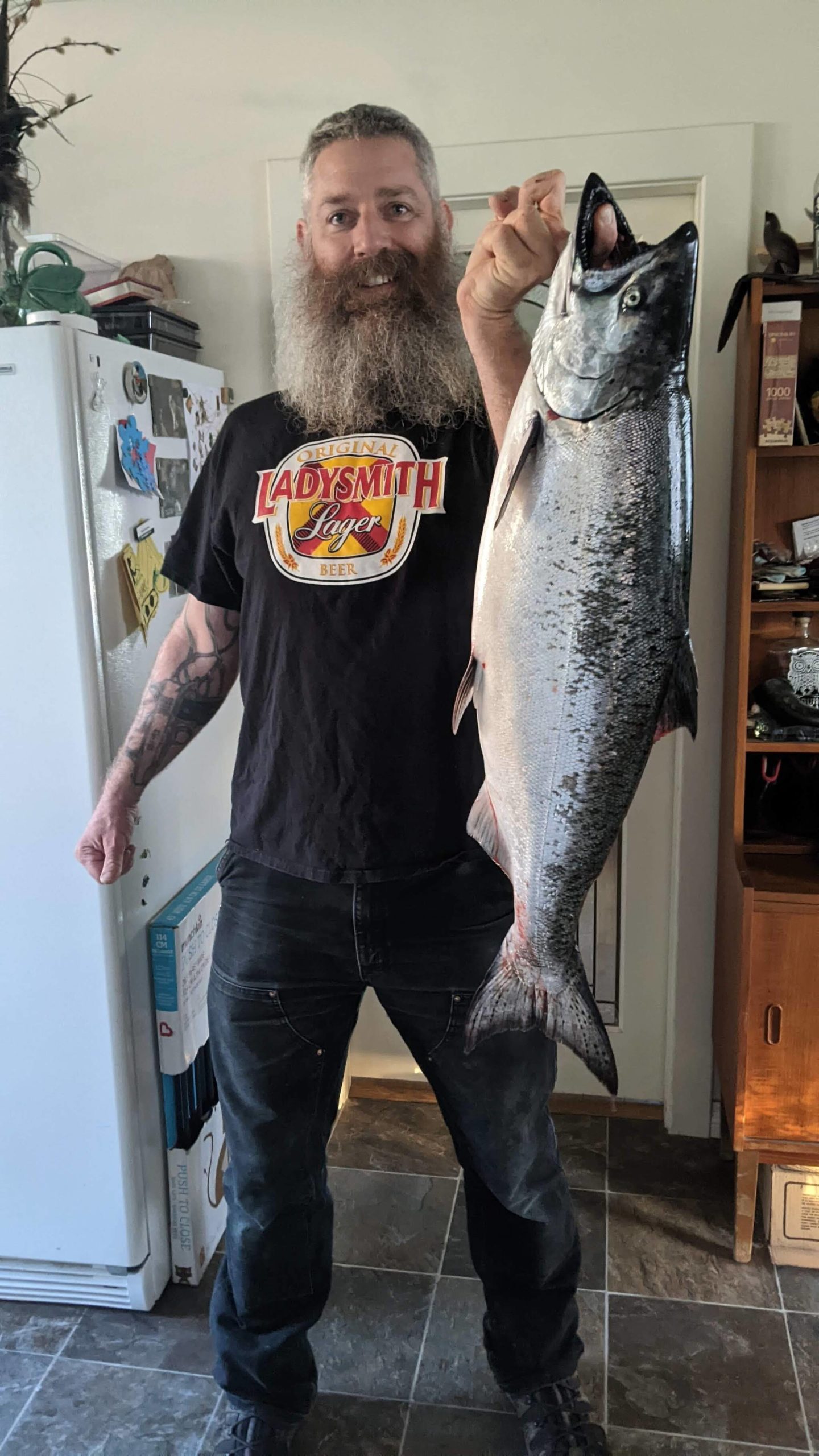 Geordie Pickard shows off the first fish he caught off his home-built boat, specially designed for exploring and fishing in the waters around Ladysmith. (Photo courtesy of Geordie Pickard)