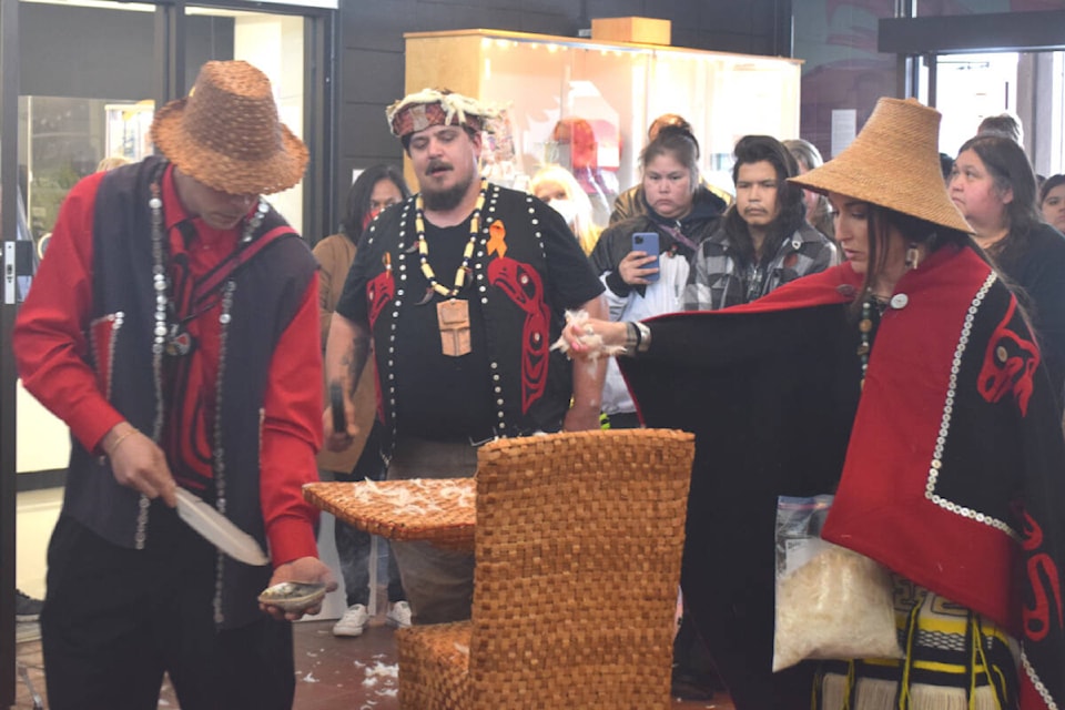 Shawn Decaire (centre) leads a smudging ceremony with Cory Cliffe (left) and Avis O’Brien over a new art installation for the Distant Relatives exhibition at the Campbell River Art Gallery. Ronan O’Doherty photo/ Campbell River Mirror