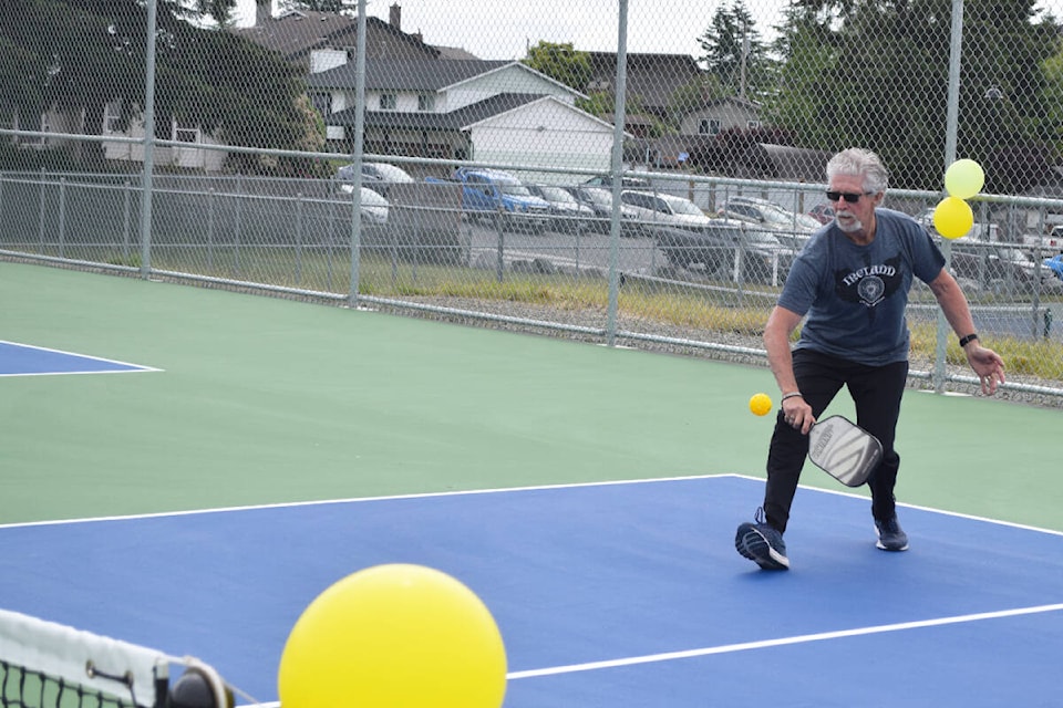 Campbell River Pickleball Association president, Graham Hues, gets in a few hits at the opening of the new courts at Robron Athletic Park on June 18, 2022. Ronan O’Doherty photo