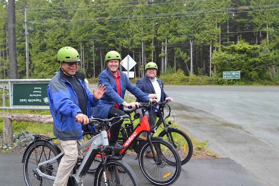 Riding the road to reconciliation, T̓iick̓in (Thunderbird) Ebikes owner Gordon Taylor Jr., front, takes MP John Aldag and MP Gord Johns out for a test ride on the newly minted ʔapsčiik t̓ašii (pronounced ups-cheek ta-shee) trail. (Nora O’Malley photo)