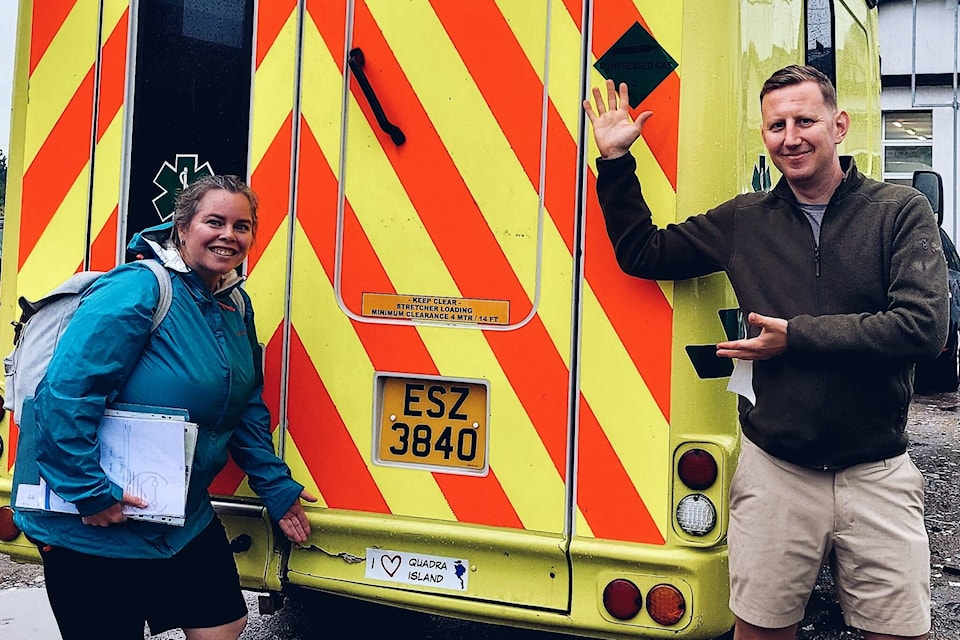 Representatives from Ambulances for Ukraine with the vehicle in Warsaw, Poland showing off the “I Love Quadra Island” sticker. Photo courtesy Peter Skilton