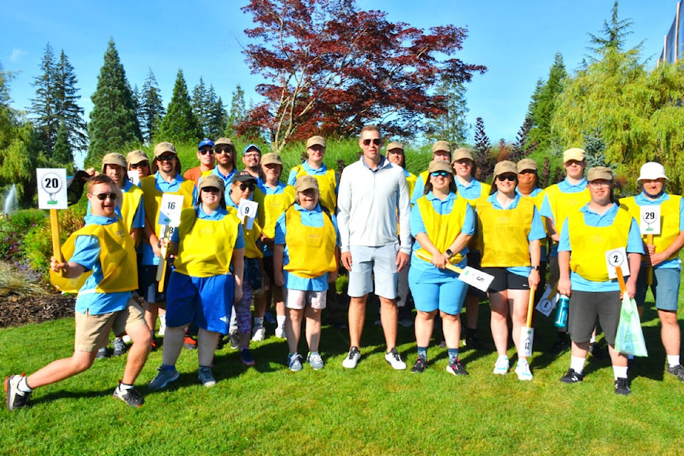 Ready for a great day of golf is ex-NHLer Clayton Stoner (centre) and Campbell River Special Olympic athletes who served as caddies during the 33rd annual Howie Meeker Golf Classic at Campbell River Golf and Country Club on Saturday, Aug. 20. Stoner has taken over as host of the popular fundraiser since Meeker’s passing Nov. 8, 2020. Photo by Alistair Taylor