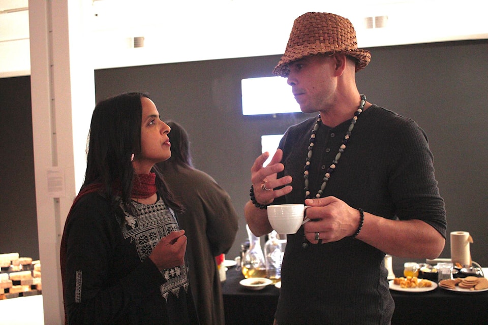 Farheen HaQ (left) chats with Cory Cliffe at the event closing HaQ’s show on Nov. 4. Photo by Marc Kitteringham/Campbell River Mirror