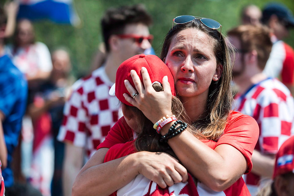 31123562_web1_221125-CPW-Croatian-Canadians-World-Cup-hug_1