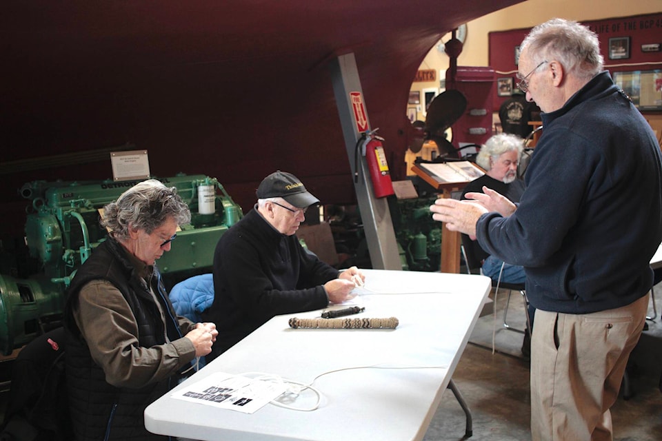 Instructor Ruedi Pletscher guides Dave Lawrence (left) and Bob Tonkin through the Turkish Head Knot at the Campbell River Maritime Heritage Centre on Jan. 28. Photo by Marc Kitteringham/Campbell River Mirror