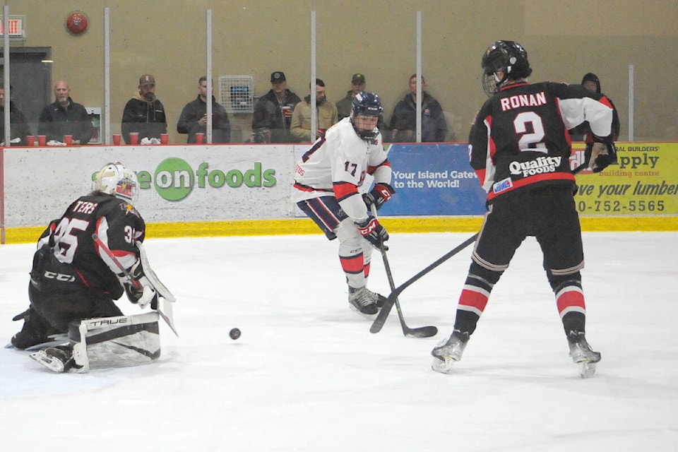 Oceanside Generals Evan Dyce backhands a shot that was saved by Campbell River Storm goalie Nick Peters. (MIchael Briones photo)