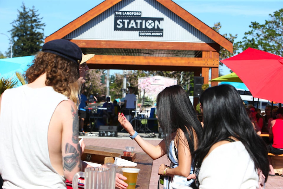 Revellers enjoy the first Friday at the Station pop-up beer and music event organized by the Victoria Beer Society and held at Langford Station Friday, May 12. At the event, the society announced the popular Langford Beer Festival is returning larger than ever July 15 to Starlight Stadium. (Justin Samanski-Langille/News Staff)