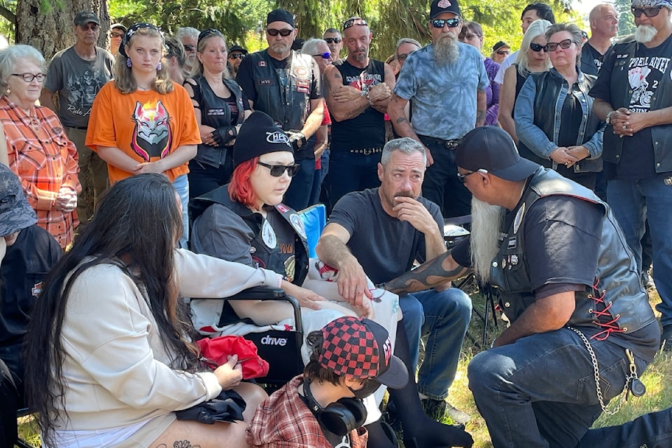 Sam Singh, Eagle Riders of Campbell River president, makes 18 year-old Joline Robertson an honorary member of the biker group on Sunday (June 29). 