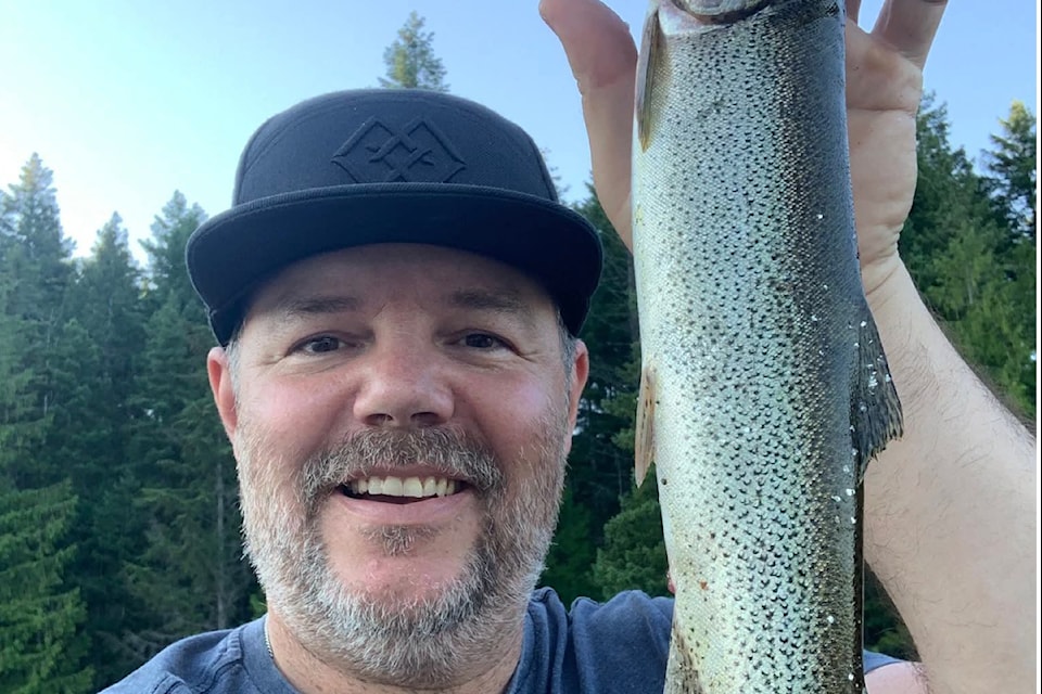 Jeffrey James with a cutthroat trout ob Mohun Lake,