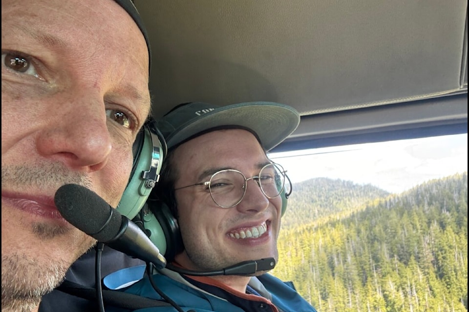 Michael King and his son Robert inside the CRSAR deployed a helicopter on May 18, after they had been safely rescued from a beach in Sea Otter Cove in Cape Scott Provincial Park, located at the northwestern tip of Vancouver Island. 