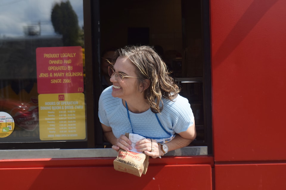 Campbell River Mirror's Jacquie Duns, publisher, works the McDonald's drive-thru as part of the location's McHappy Day fundraiser. 