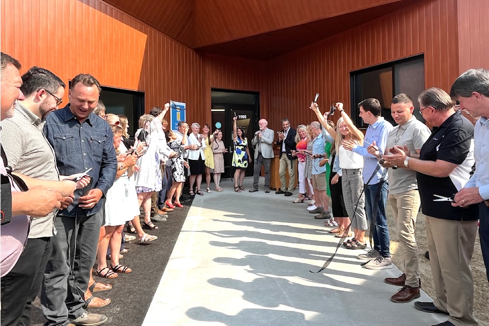 About 250 people gathered Aug. 23 for the official opening of The Confluence, the new multi-purpose Chamber of Commerce and Visitor Centre building at 1995 6th Ave. in Castlegar. The ribbon was jointly cut by almost 30 people that played a role in seeing the project accomplished.