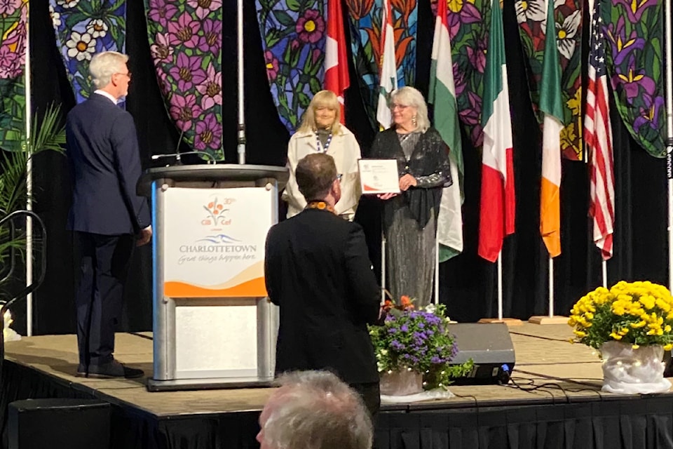 Darlene Kalawsky of the Castlegar Communities in Bloom team accepts the Five Blooms Award in Charlottetown, PEI.