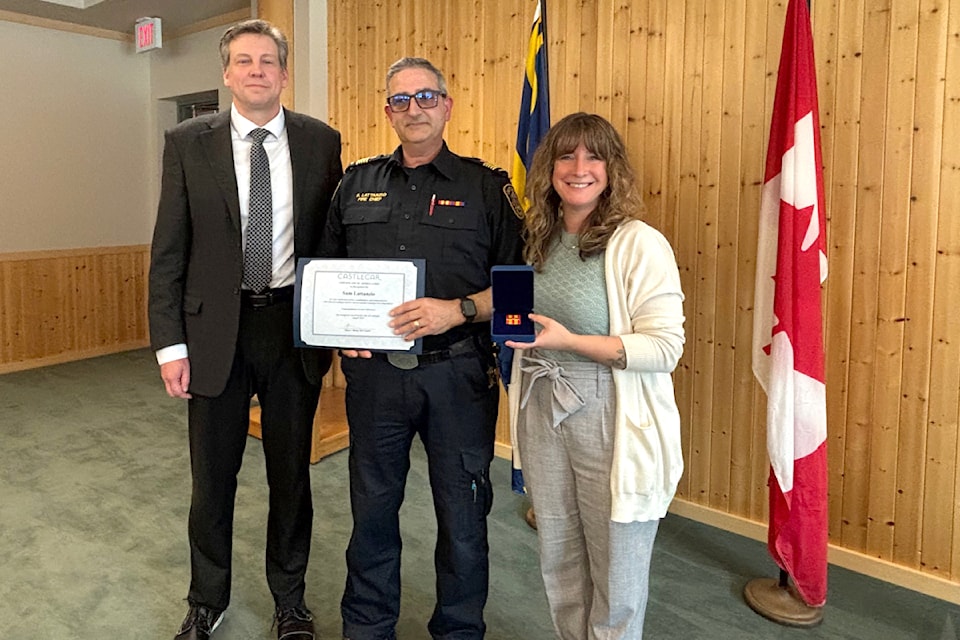 Castlegar CAO Chris Barlow (L) and Mayor Maria McFaddin (R) shared their appreciation for Fire Chief Sam Lattanzio's service.