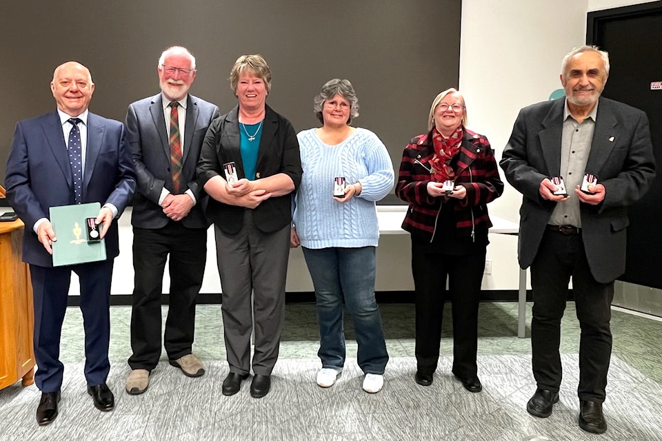 (L-R) Dan Ashman, MP Richard Cannings, Sandi McCreight, Deb McIntosh, Morag Carter and Vince Salvo. Canings presented the individuals with King Charles III Coronation Medals on March 4.