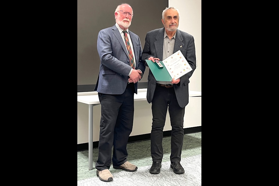 MP Richard Cannings presents Vince Salvo a King Charles III Coronation Medal at a Castlegar ceremony on March 4.