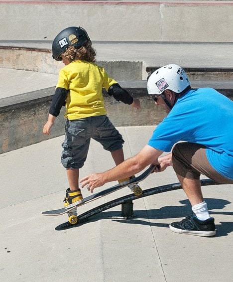 92801castlegarSkateparkNeko-skating-the-rainbow-rail_photo-Sophie-Wong-Cornish