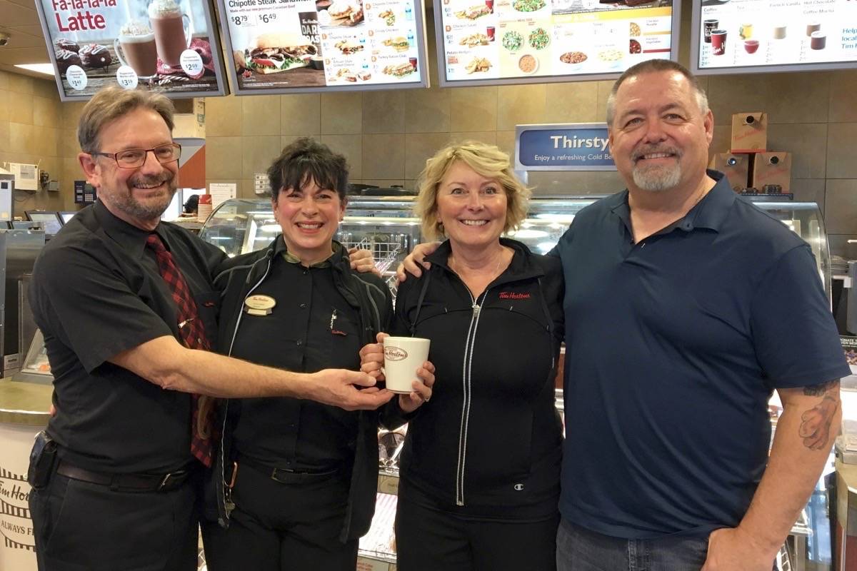 Chris and Kathy Sykes hand over Castlegar Tim Horton's to new