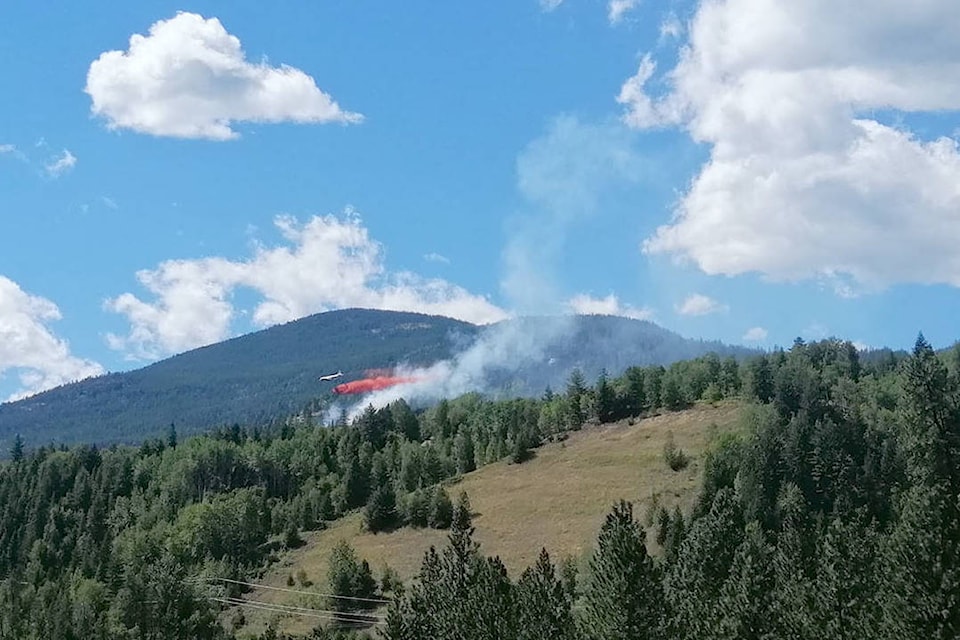 22493610_web1_200827-CAN-china-creek-fire-bomber_1