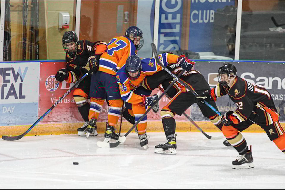 The Castlegar Rebels took down the Beaver Valley Nitehawks 4 -1 on Sept. 29. All of the goals in the game were scored in the third period. Hometown favourite Travis Green was in the stands and he took the time to stop and pose for a photo with a minor hockey player. Photos: Jennifer Small