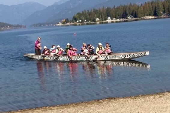 After the last paddle of the season, the Robusters celebrate a safe transfer from the beach to the new boat house. Photo: Submitted