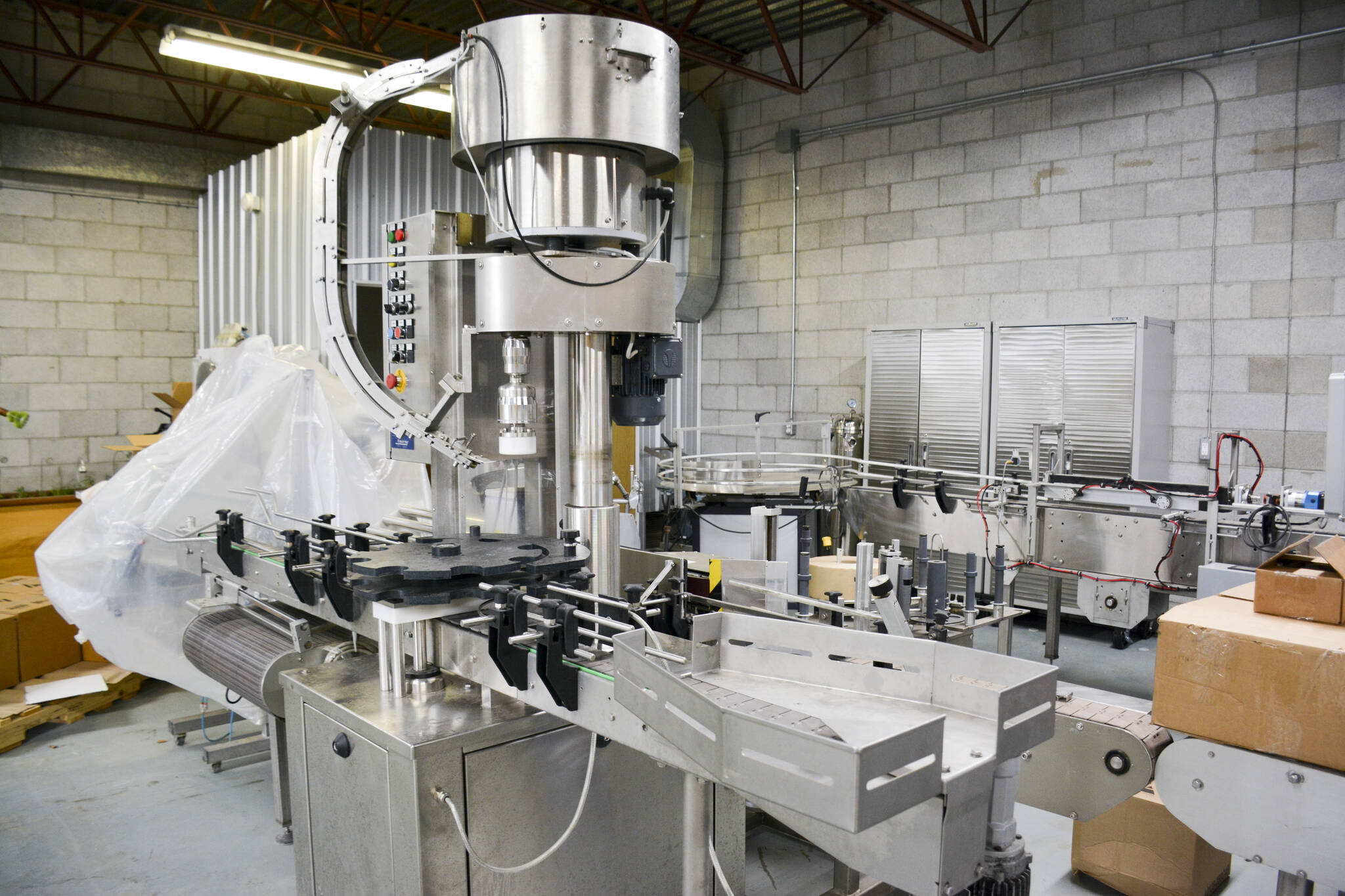 This multi-purpose filling line allows for up to 100 bottles an hour. (Photo by Kelsey Yates)