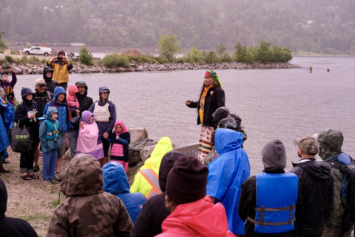Sinixt leader Shelly Boyd talked to the crowd and led a prayer before the boats were launched Photo: Bill Metcalfe