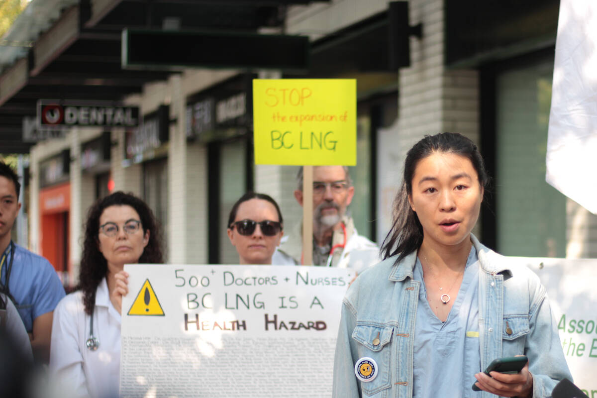 Dr. Kelly Lau, a Vancouver physician, speaks outside Premier David Ebys Vancouver constituency office Thursday (Aug. 24). The association was calling on the province to put a moratorium on future LNG projects, citing the risks associated with climate change. (Lauren Collins)