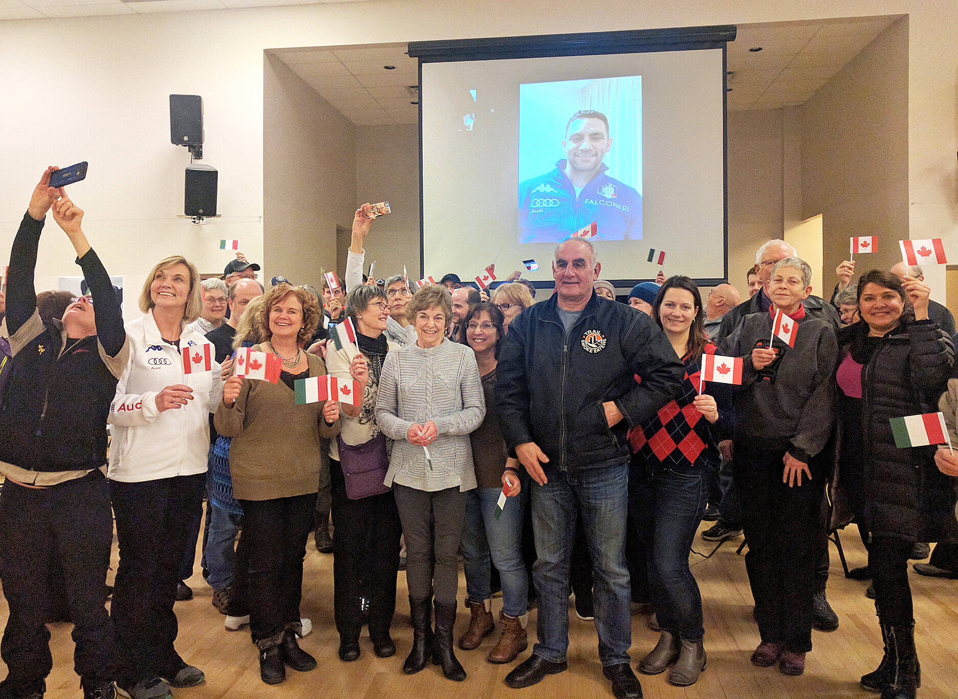 About 100 Joe Cecchini supporters gathered for a Go Joe Go! rally and a group selfie at the Fruitvale Hall in January, 2018. Cecchini appeared via Zoom to thank the Greater Trail community for its support as he prepared to compete in skeleton at the 2018 Winter Olympic Games in South Korea. Photo: Jim Bailey