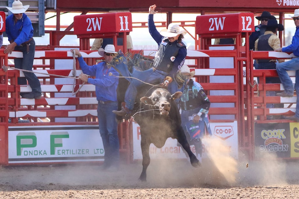 Jake Maher holds on for a wild 76.5-point ride on a bull known as Dr. Doolittle. (Kevin Sabo/Black Press Media)